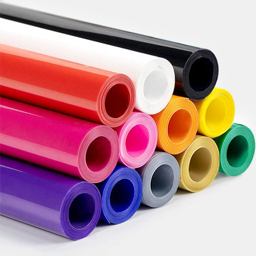 Assorted rolls of colorful vinyl on a white background