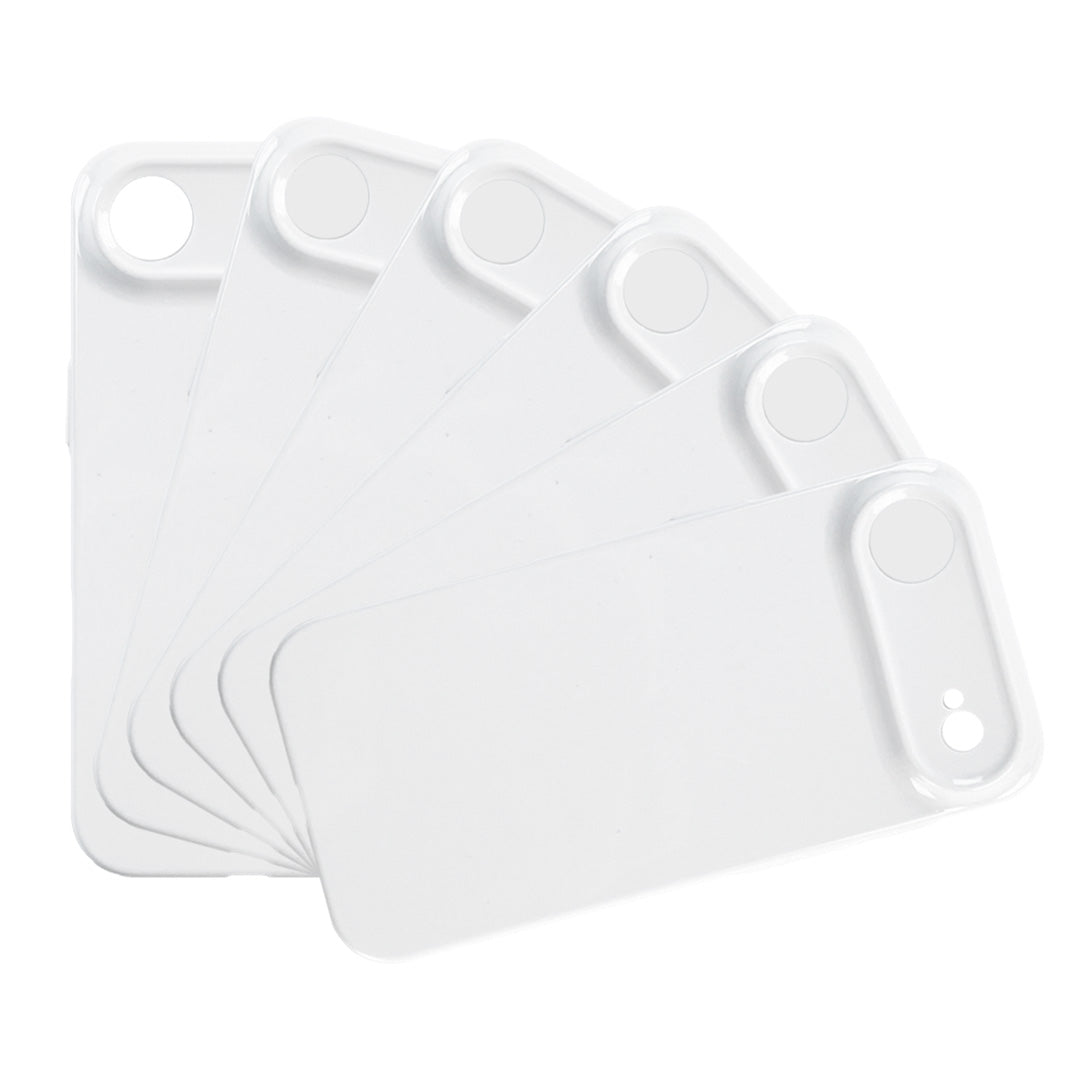 Set of white plastic cutting boards on a white background